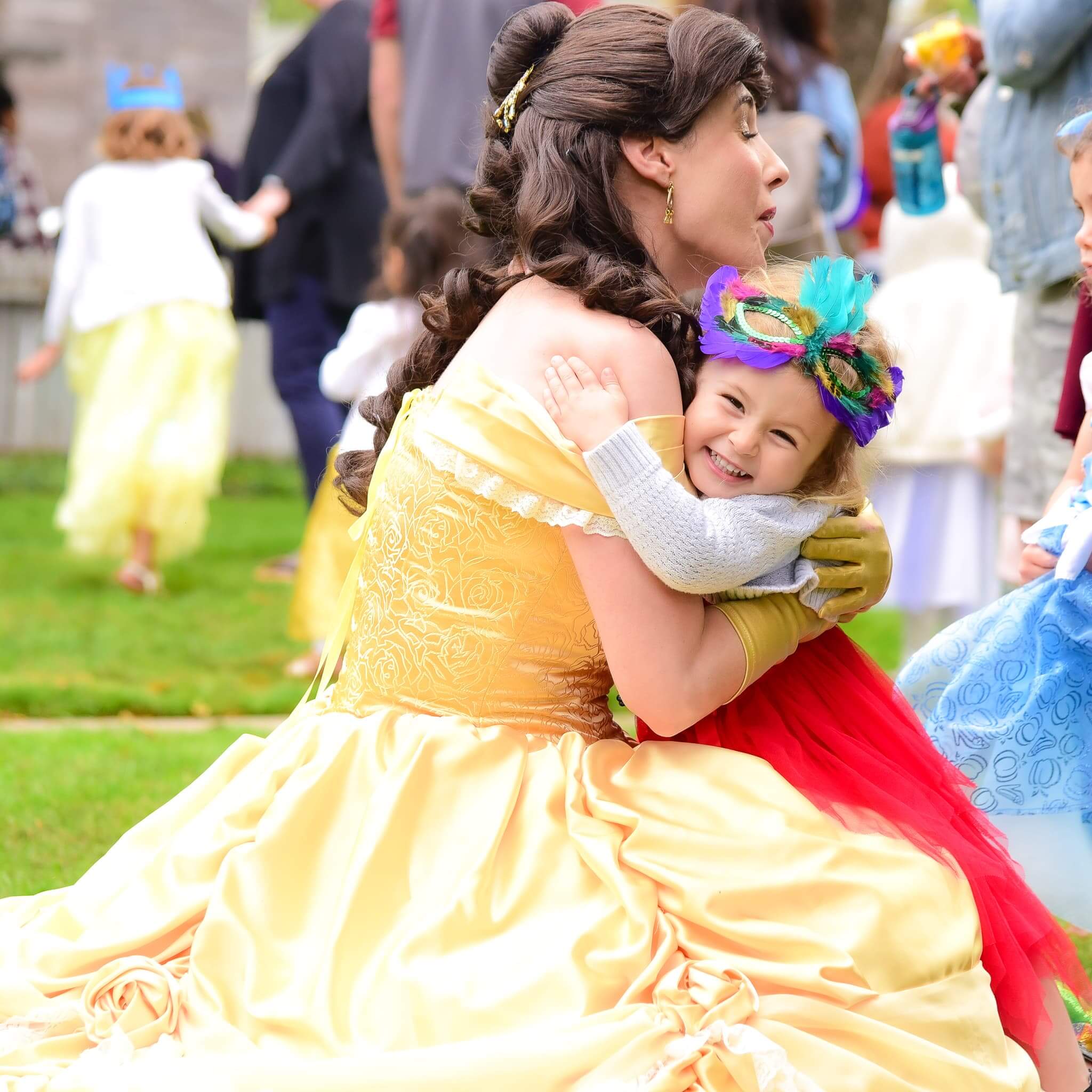 Princess Belle with little girl hugging